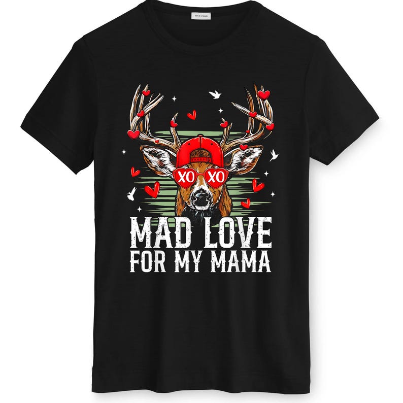 May include: Black t-shirt featuring a deer wearing a red cap and sunglasses with the text "XO XO". The deer's antlers are adorned with red heart shapes. The text "MAD LOVE FOR MY MAMA" is printed below the deer.