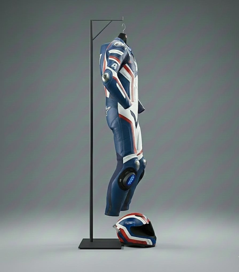 May include: A blue, white, and red racing suit hangs on a black metal stand, with a matching helmet at the base. The suit features white stripes and the number "4" on the arm. The helmet has a similar design.