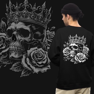 May include: Black sweatshirt featuring a detailed grayscale graphic of a skull wearing a crown, surrounded by roses. The design is repeated on the back of the sweatshirt. The image has a gothic or rock and roll aesthetic.