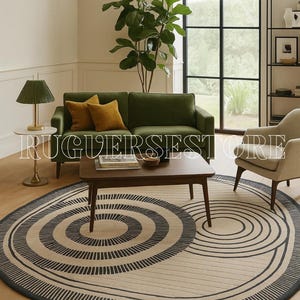 May include: A living room scene featuring a green sofa with mustard-colored pillows, a wooden coffee table, and a beige armchair. A round rug with a concentric black and beige design is the focal point. A green lamp and a large plant add to the decor.