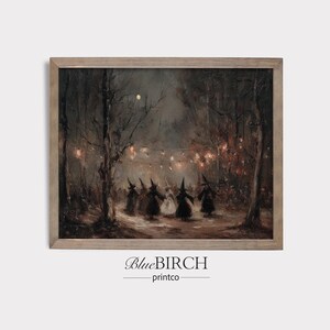 May include: A framed print of a dark, vintage-style painting depicting a group of figures in witch hats dancing in a moonlit forest. The artwork has a muted color palette with warm, glowing lights strung between the trees. The print is framed in a light brown wooden frame.
