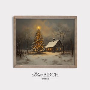 May include: A framed winter landscape print featuring a snow-covered scene with a lit Christmas tree and a barn. The artwork has a warm, inviting glow, with the text "Blue Birch printco" at the bottom.