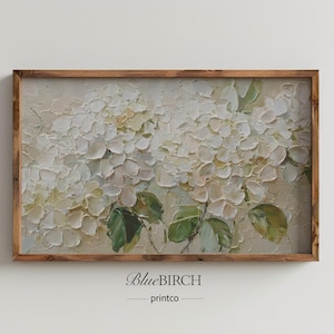 May include: A framed floral painting featuring white hydrangea blooms with green leaves. The artwork has a textured, impasto style and is set in a rustic wooden frame. The text "BlueBIRCH printco" is at the bottom.