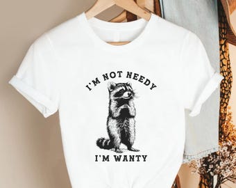 I’m Not Needy I’m Wanty Shirt, Funny Raccoon Graphic Tee, Pink Unisex T-Shirt, Cute Animal Humor Top, Sarcastic Quote Gift for Women Men