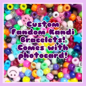 May include: A vibrant mix of beads in diverse shapes and sizes, such as smiley faces, stars, and skulls. The image includes the text: "Custom Fandom Kandi Bracelets! Comes with photocard!"