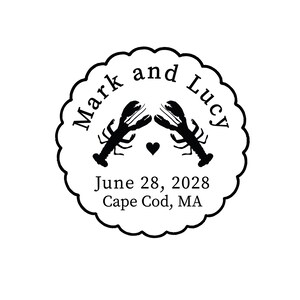 May include: A circular stamp with a scalloped edge features the names "Mark and Lucy" above two lobster illustrations. The date "June 28, 2028" and location "Cape Cod, MA" are printed below. A small heart is between the lobsters.