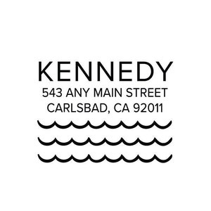 May include: Black and white return address label with the text "KENNEDY 543 ANY MAIN STREET CARLSBAD, CA 92011" and a graphic of three wavy lines representing ocean waves.