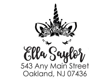 May include: Black and white return address stamp with a unicorn head design featuring a crown, flowers, and eyelashes. The text reads "Ella Saylor 543 Any Main Street Oakland, NJ 07436".