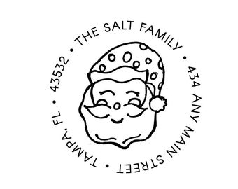 May include: A circular stamp design featuring a smiling Santa Claus face wearing a polka-dot hat. The text around the image reads "THE SALT FAMILY", "43532", "TAMPA, FL", and "434 ANY MAIN STREET".
