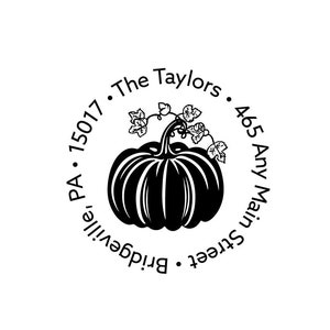 May include: A black and white round return address stamp with a pumpkin design. The text reads: "The Taylors. 465 Any Main Street. Bridgeville, PA. 15017."