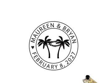 May include: A black and white round stamp with the text "MAUREEN & BRYAN" and "FEBRUARY 8, 2027". The stamp features two palm trees with string lights. A small ink pad and stamp are in the lower right corner.