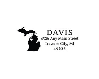 May include: Black and white silhouette of the state of Michigan with a small red heart in the center. The text "DAVIS" is in all caps, followed by the address "4326 Any Main Street Traverse City, MI 49685".