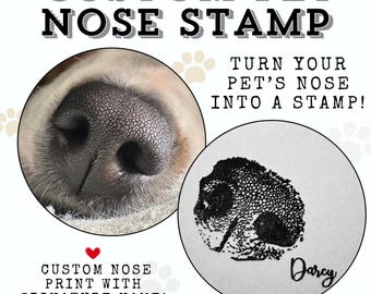 May include: A close-up of a dog's nose, with a black and white print of the nose on a white background. The print has the name "Darcy" written underneath. The text "CUSTOM PET NOSE STAMP" is at the top of the image, and the text "TURN YOUR PET'S NOSE INTO A STAMP!" is on the right side of the image. The text "CUSTOM NOSE PRINT WITH SIGNATURE NAME!" is at the bottom of the image.