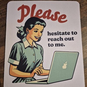 May include: A white mouse mat featuring a vintage-style illustration of a woman with a laptop. The word "Please" is in red script above the woman. Text below the woman reads "hesitate to reach out to me."