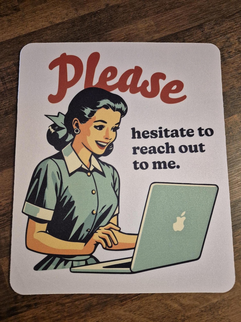 May include: A white mouse mat featuring a vintage-style illustration of a woman with a laptop. The word "Please" is in red script above the woman. Text below the woman reads "hesitate to reach out to me."