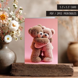 May include: A greeting card featuring two plush teddy bears hugging on a pink background. The card is 5.3" x 5.3" and includes the text "PDF / JPEG PRINTABLES". A vase of flowers sits to the left.