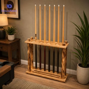 May include: A floor-standing wooden pool cue rack with a natural bark-edge finish on the side supports. The rack features a top shelf with circular cutouts for six cues and a bottom base with slots to hold the cue ends securely in an upright position.