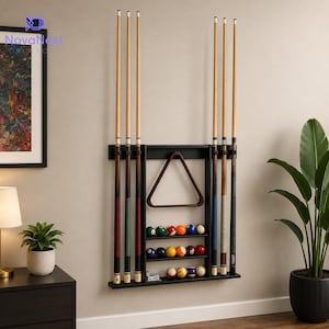 May include: A black wall-mounted pool cue rack featuring six vertical slots for billiard cues, a central triangular rack for balls, and three horizontal shelves holding a set of fifteen colorful billiard balls in various numbered designs.