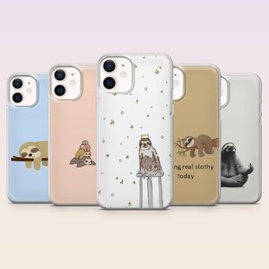 May include: A collection of five phone cases with sloth designs. The cases feature various sloth illustrations, including sloths on branches, a sloth wearing a crown, and a sloth with the text "ng real slothy today". The cases are in shades of blue, pink, and tan.