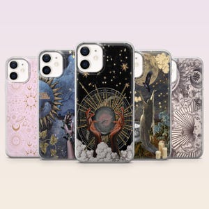 May include: Five clear phone cases with mystical and celestial designs. The cases feature illustrations of the sun, moon, stars, hands, and other esoteric symbols in shades of pink, blue, and black. A collection of phone accessories.