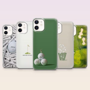 May include: A collection of five phone cases with golf-themed designs. The cases feature images of golf balls, tees, a golf course, and a golf basket. The cases are in various colors, including white, green, and beige.