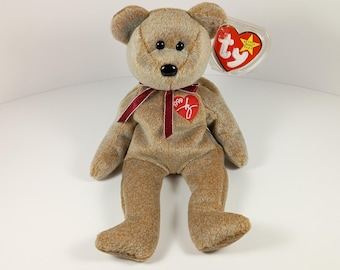 Oso de peluche Signature Bear TY Beanie Babies de 1999 - 21,5 cm (8,5 pulgadas) de relleno de bolitas de polietileno, color marrón cacao.