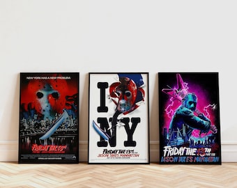 May include: Three framed movie posters from the "Friday the 13th" horror film series. The posters feature Jason Voorhees, a hockey mask, and the text "Friday the 13th" and "Jason Takes Manhattan". The posters are displayed on a light wood floor.