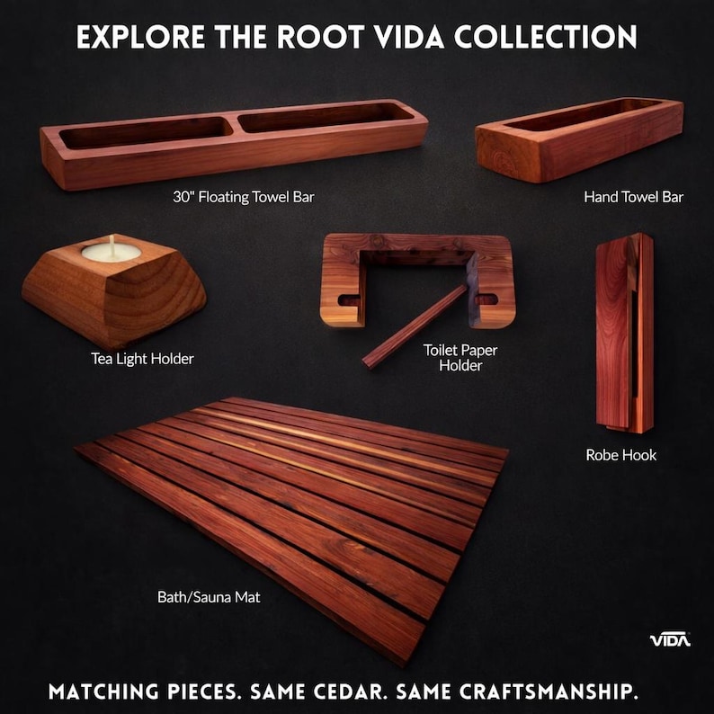 May include: The Root Vida collection features cedar wood bathroom accessories including a 30-inch floating towel bar, a hand towel bar, a tea light holder, a toilet paper holder, a robe hook, and a slatted bath or sauna mat on a dark background.