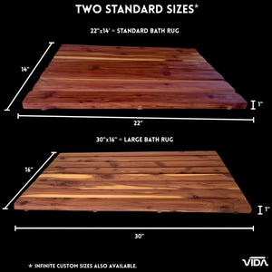 May include: Two rectangular wooden bath rugs with a slatted design. The top rug is labeled 22 inches by 14 inches by 1 inch. The bottom rug is labeled 30 inches by 16 inches by 1 inch. Text reads TWO STANDARD SIZES, INFINITE CUSTOM SIZES ALSO AVAILABLE, and VIDA.