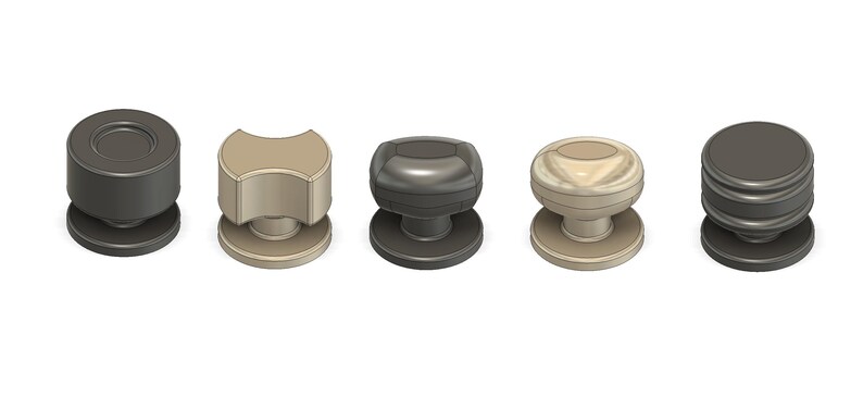 May include: Five cabinet knobs in different designs and colours are displayed. The knobs include a dark grey cylindrical knob, a tan, curved knob, a dark grey rounded knob, a tan, rounded knob, and a dark grey, stacked knob.