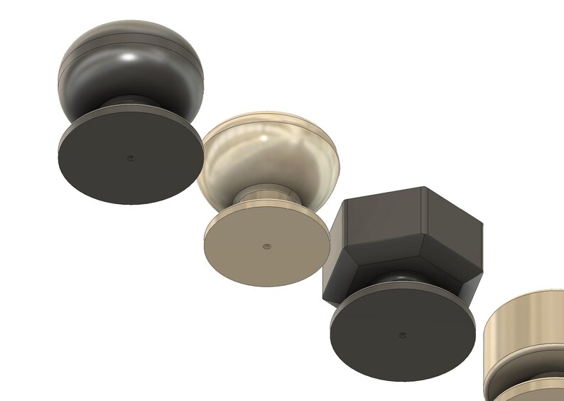 May include: A selection of cabinet knobs in different shapes and finishes. The knobs include a dark grey sphere, a light beige sphere, a dark grey faceted knob, and a gold cylindrical knob. Each knob has a circular base.