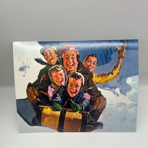 May include: Vintage illustration of a group of people joyfully sledding down a snowy hill. The image features five people, bundled in winter clothing, laughing as they ride a wooden sled. The background shows a snowy landscape and a blue sky.
