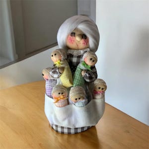 Little old lady with 6 babies long lashes plush signed dated 1981 vtg 9"