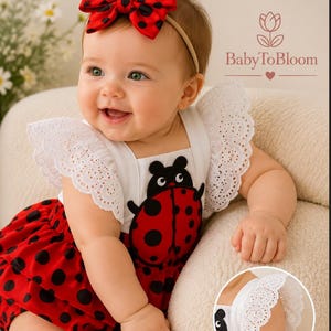 May include: A baby in a red and black ladybug-themed outfit, with a matching bow headband. The romper has a white top with lace sleeves and a ladybug design. The outfit is designed for infants.