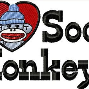 May include: A red heart with a sock monkey wearing a blue hat. The text "I love Sock Monkeys" is below the heart.