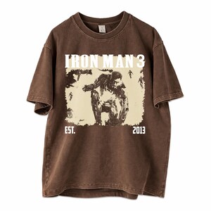 May include: A set of three ceramic mugs with a speckled, matte finish in cream, light grey, and dark grey. Each mug has a simple, minimalist design, suitable for coffee or tea.