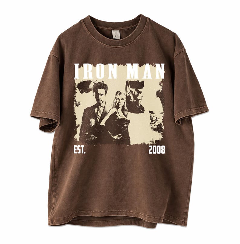 May include: Brown t-shirt with an Iron Man graphic, the words "IRON MAN" above the image, and "EST. 2008" below. The shirt has a vintage, distressed appearance.