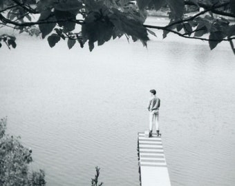 Black and White 1969 Photo - "The Lucky Lake Thinker" - Man Standing Dock Pier, Looking at Water River, Dream-like Vernacular Image - 113