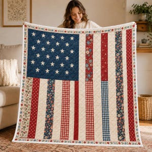 May include: A quilted throw blanket featuring a stylised American flag design. The blue canton contains white stars, while the stripes are composed of alternating vertical panels in red, white, and blue with floral, gingham, and polka dot patterns.