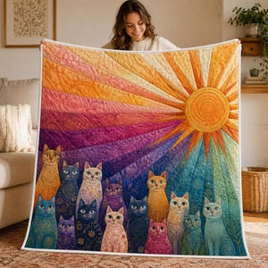 May include: A quilted throw blanket featuring a vibrant sunburst pattern in shades of orange, yellow, pink, purple, and blue. The design includes a central sun and a group of twelve stylized cats in various colors, each with intricate swirling patterns.