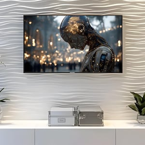 May include: A flat-screen television displaying a futuristic image is mounted on a white, textured wall. Below, two silver storage boxes sit on a white cabinet. A potted plant is visible on the right.