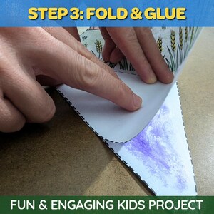 May include: A craft project in progress, with the text "STEP 3: FOLD & GLUE" at the top. The image shows hands folding a paper cutout with a wheat design. The bottom of the image reads "FUN & ENGAGING KIDS PROJECT."