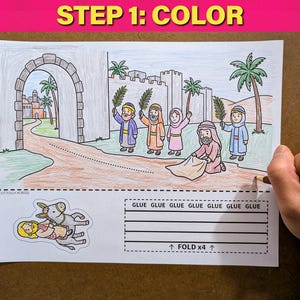 May include: A coloring page with the text "STEP 1: COLOR" at the top. The illustration depicts a biblical scene with figures holding palm branches. The bottom of the page has instructions for gluing and folding.