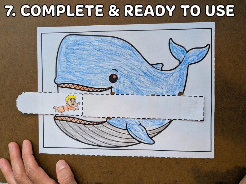 May include: A blue whale coloring page with a cut-out section and a small illustration of a person. The text "7. COMPLETE & READY TO USE" is at the top. The whale is colored in blue, with a gray underbelly and a smiling face.