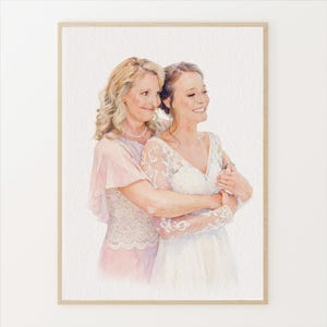 May include: Watercolor portrait of two women, one in a white lace wedding dress and the other in a pink dress. The women are embracing, with the older woman's arm around the younger woman. The artwork is framed in a light brown wooden frame.