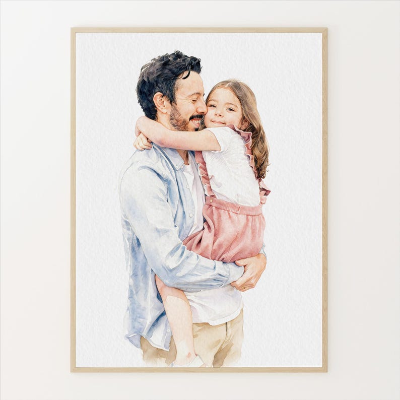 May include: Watercolor portrait of a father and child embracing. The father, with dark hair and a light blue shirt, holds the child, who wears a white top and pink overalls. The artwork is framed in a light wood tone.