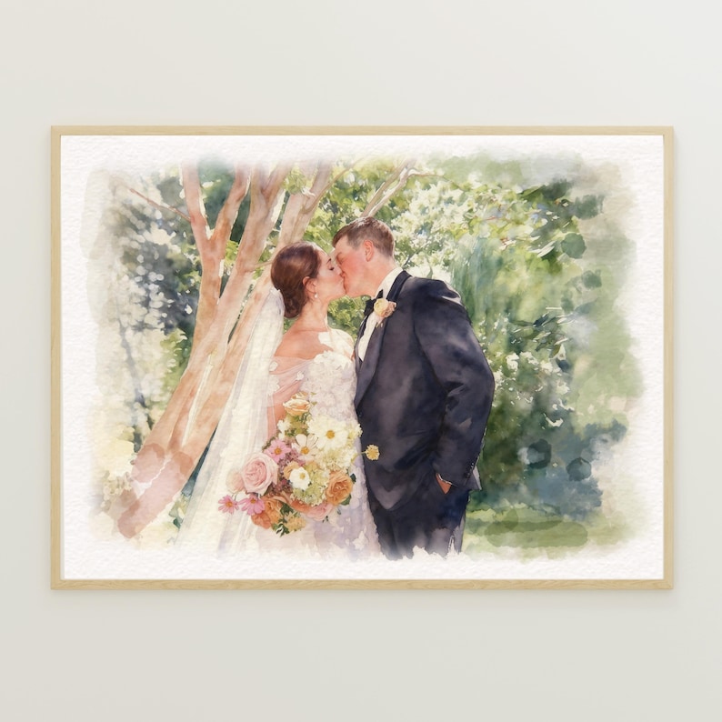 May include: Watercolor painting of a wedding couple kissing under a tree. The bride wears a white dress and veil, holding a bouquet of flowers. The groom is in a black suit. The artwork is framed in a light wood frame.
