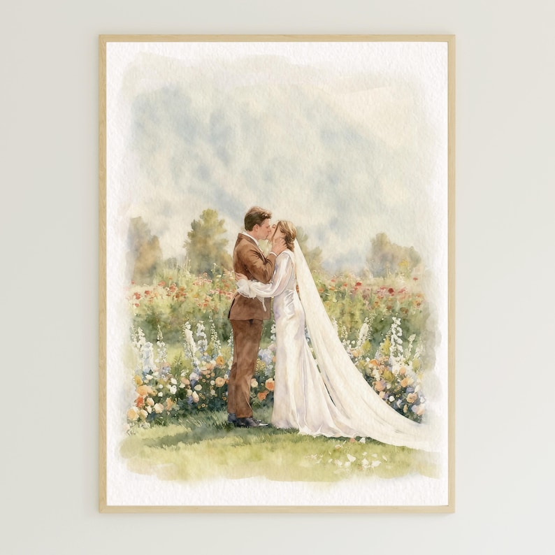 May include: Watercolor painting of a couple kissing in a field of flowers. The man wears a brown suit, and the woman is in a white wedding dress with a long veil. The artwork is framed in a light wood frame.