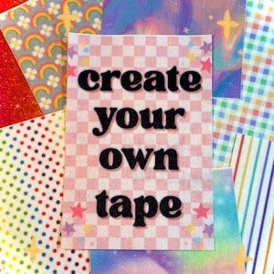 May include: A collection of colorful decorative tapes. The central tape features the text "create your own tape" in black letters on a pink and white checkered background. Other tapes have rainbow, star, and polka dot patterns.