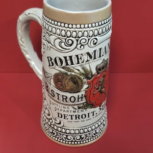 May include: A handmade wooden sign with the text "Welcome to our home" in a handwritten style. The sign is painted white with black lettering and a distressed finish, perfect for home decor.